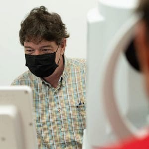eye docter JD wearing mask checking on patient European Eye Center