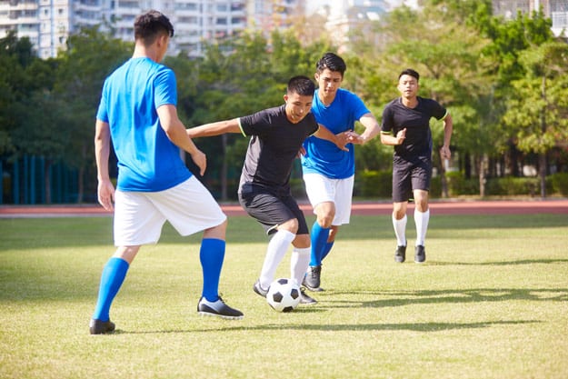 group-of-asian-men-playing-football-ss | Places to Play Different Kinds of Sports in Thao Dien